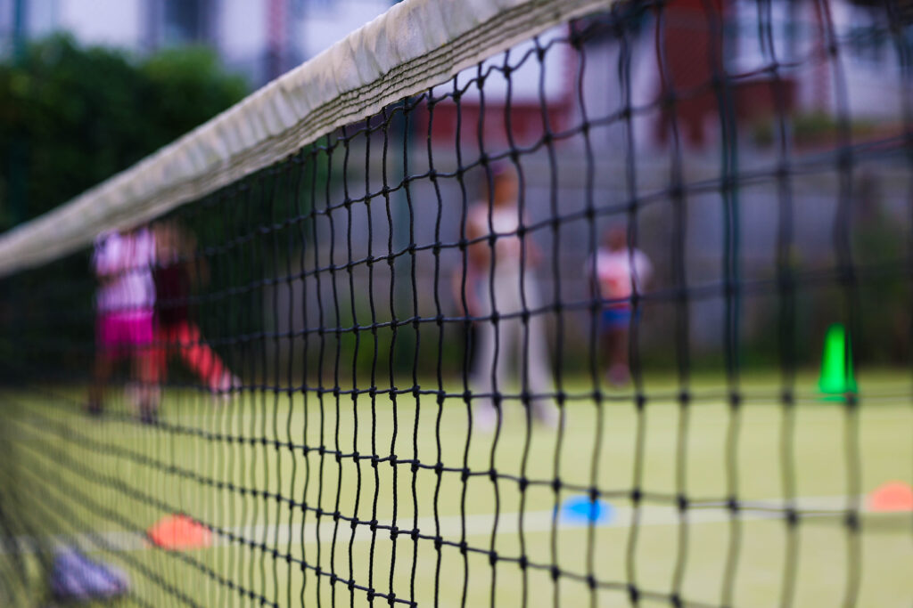 net with young people in the background